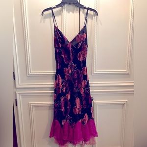 GUC on this much loved floral, knee length evening dress made of rayon and silk.